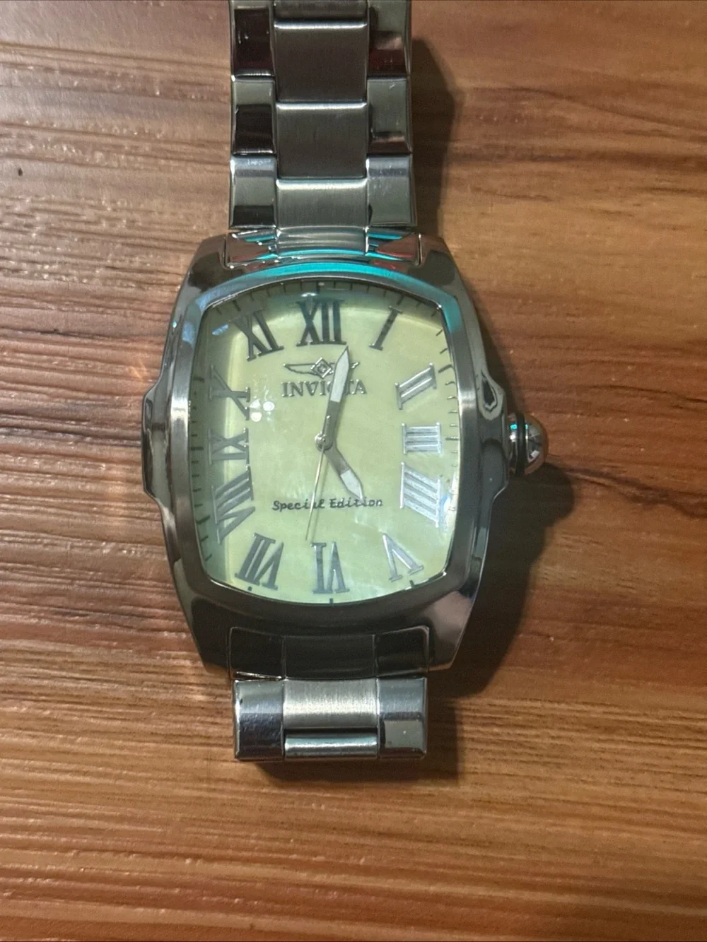 Watch on wooden surface